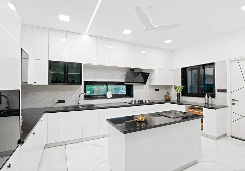 All-white kitchen with a black-topped island