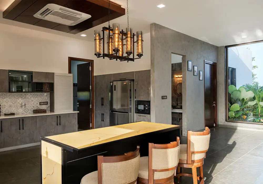 Dry kitchen with an island and bar stools